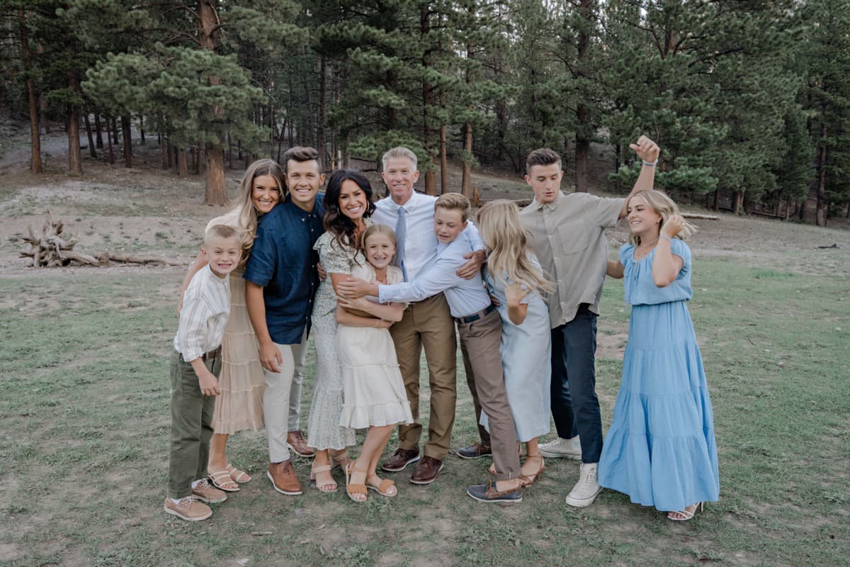 Large family laughing in a group hug at Mt Charleston