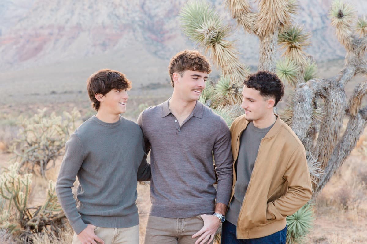 Three brothers laughing by a Joshua tree at Red Rock, Las Vegas