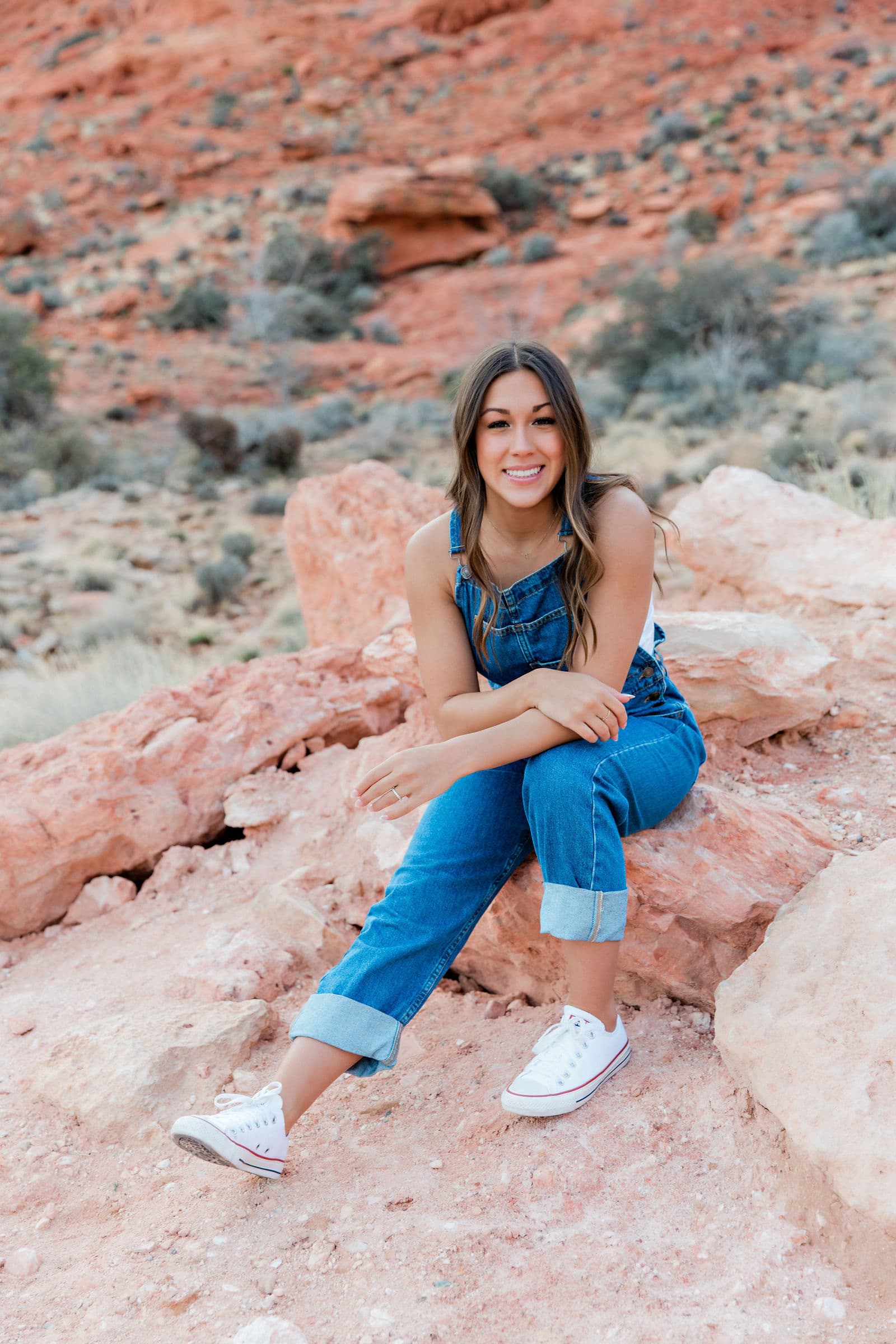 Senior girl in overalls at Red Rock