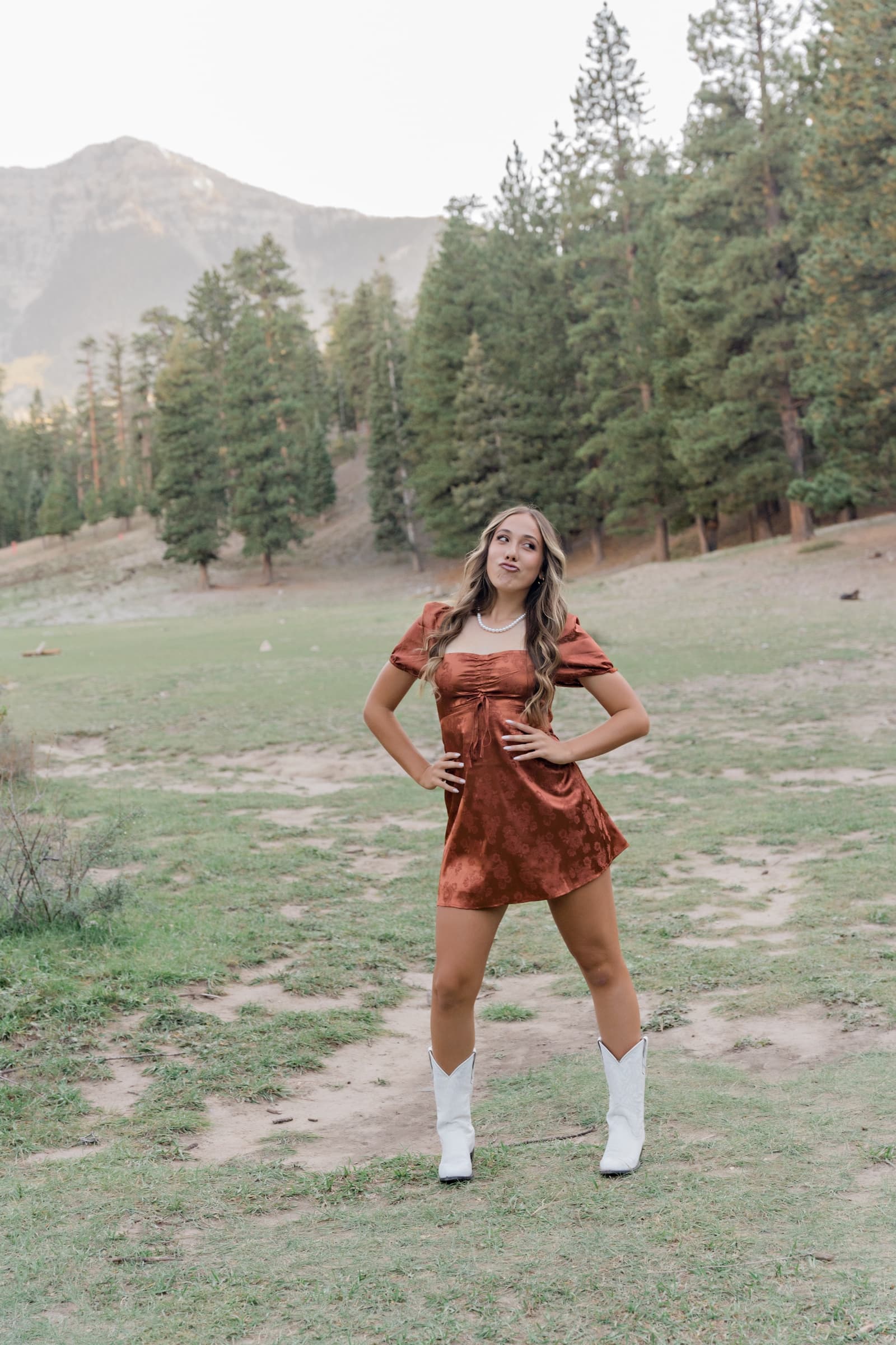 Senior girl rust dress cowboy boots at Mt Charleston