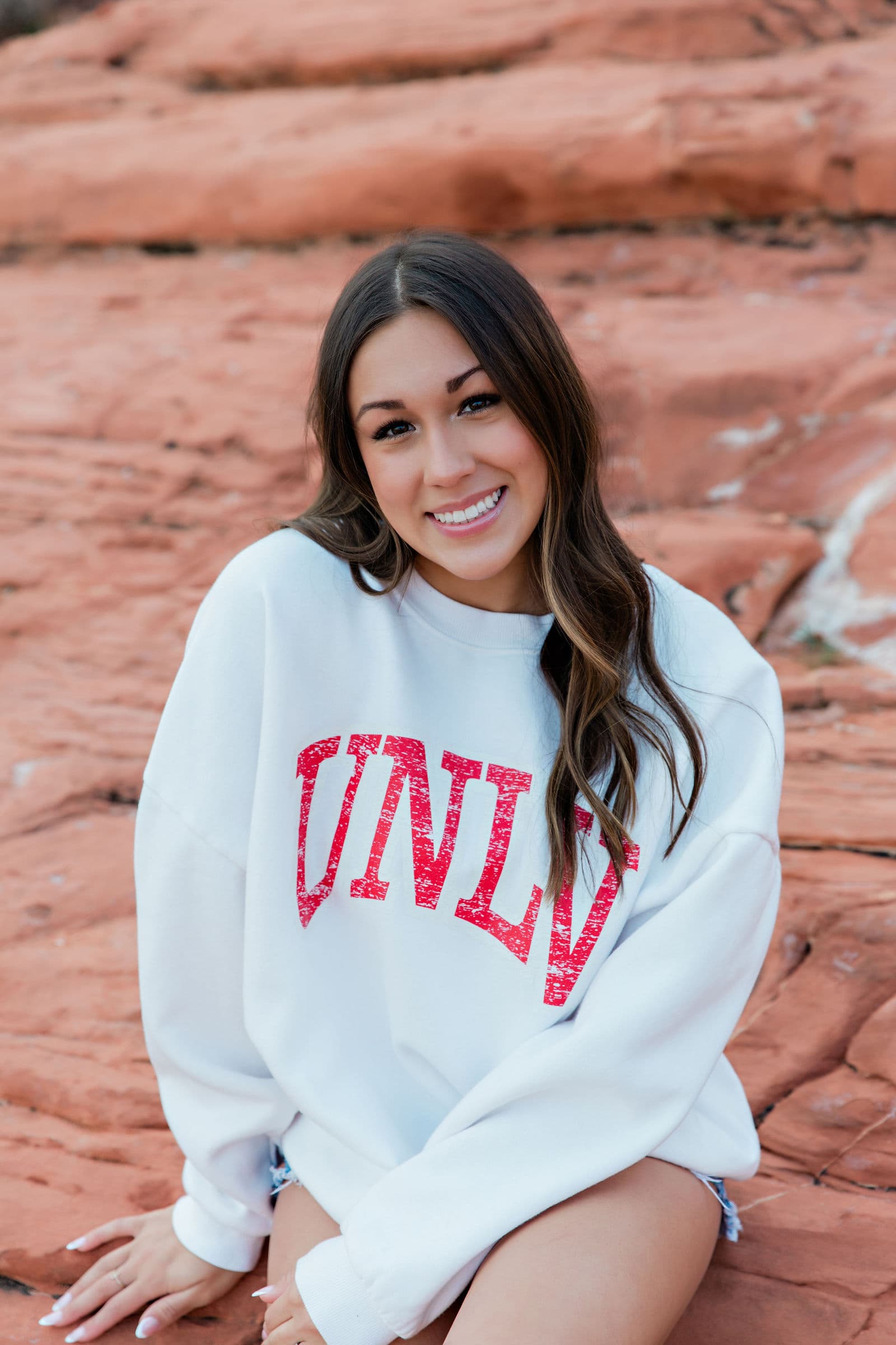 Senior in UNLV sweatshirt at Red Rock