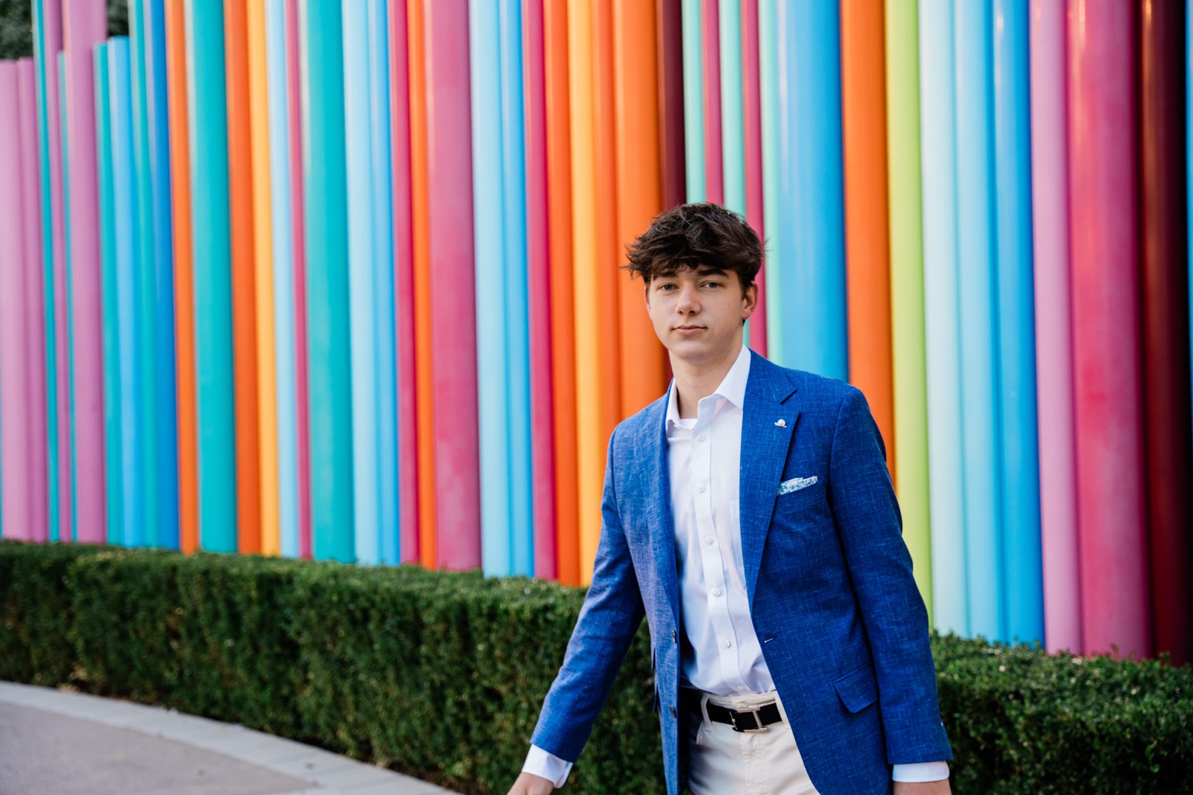 Senior boy blue blazer rainbow columns at Smith Center