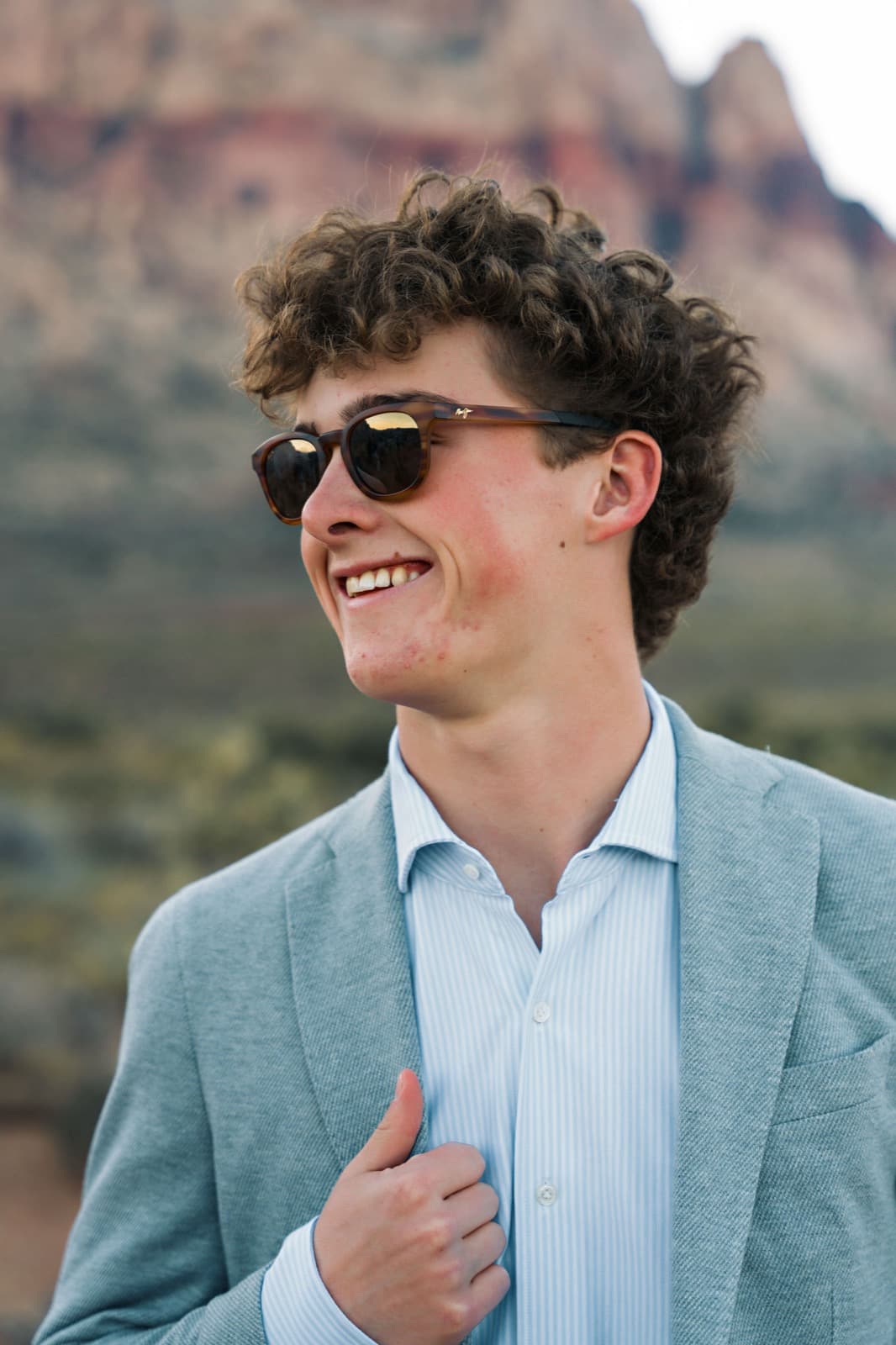 Senior boy sunglasses and blue blazer at Red Rock