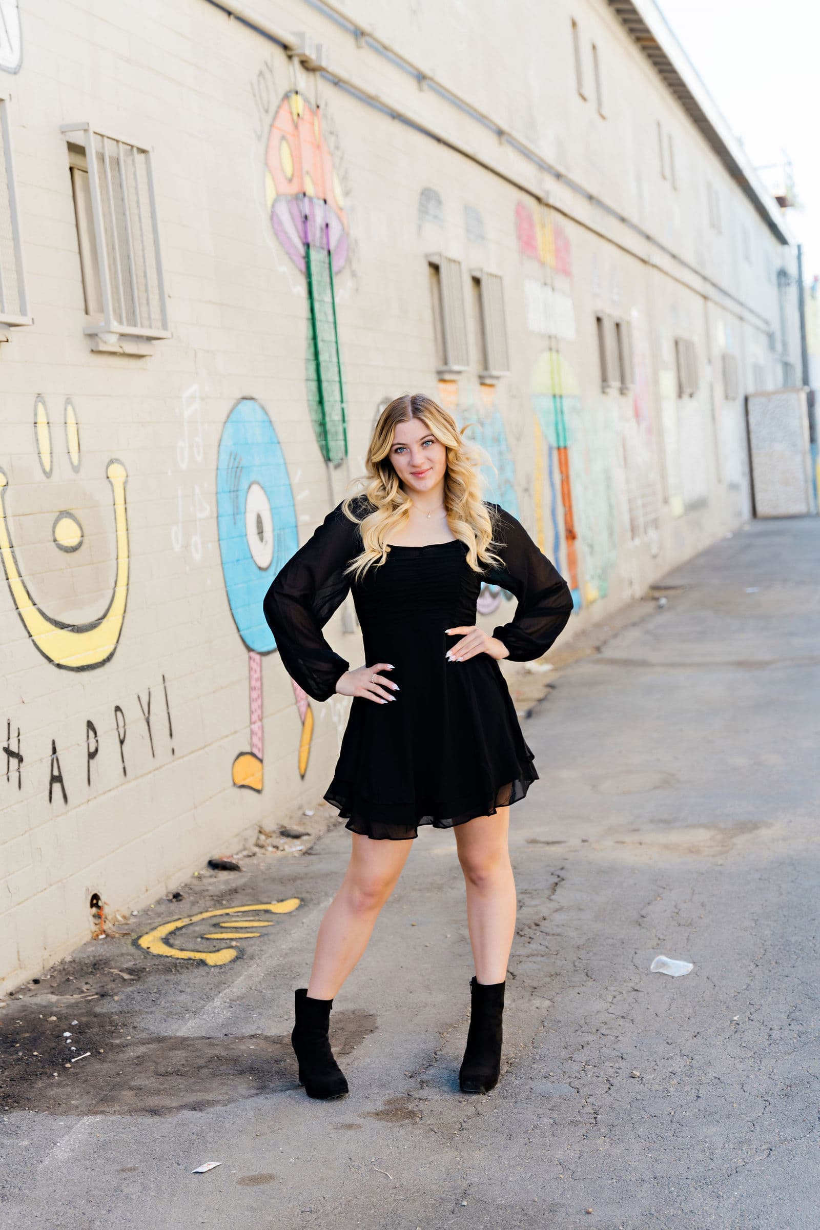 Senior girl black mini dress at HAPPY mural