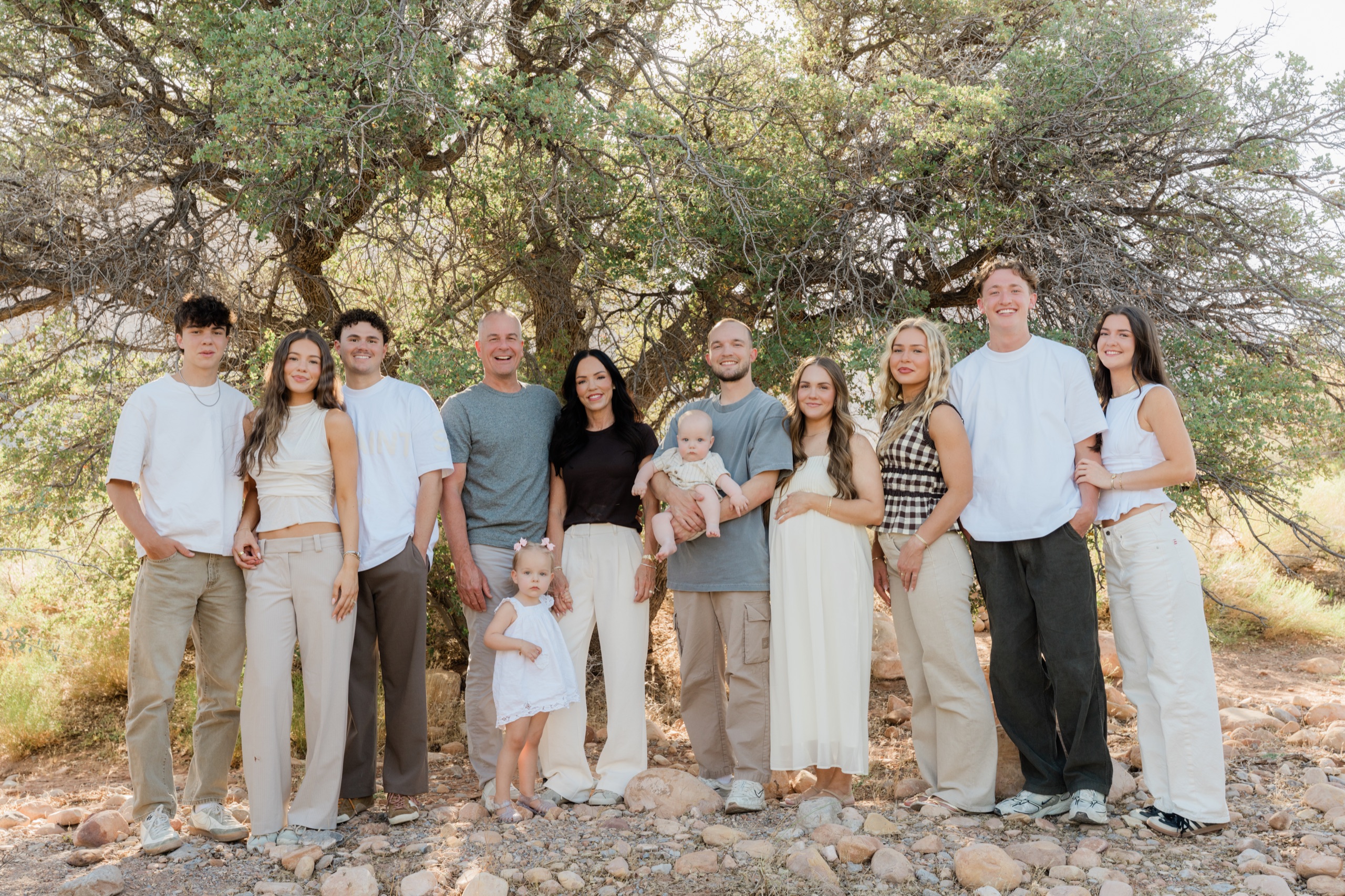 The family gathered under a desert tree