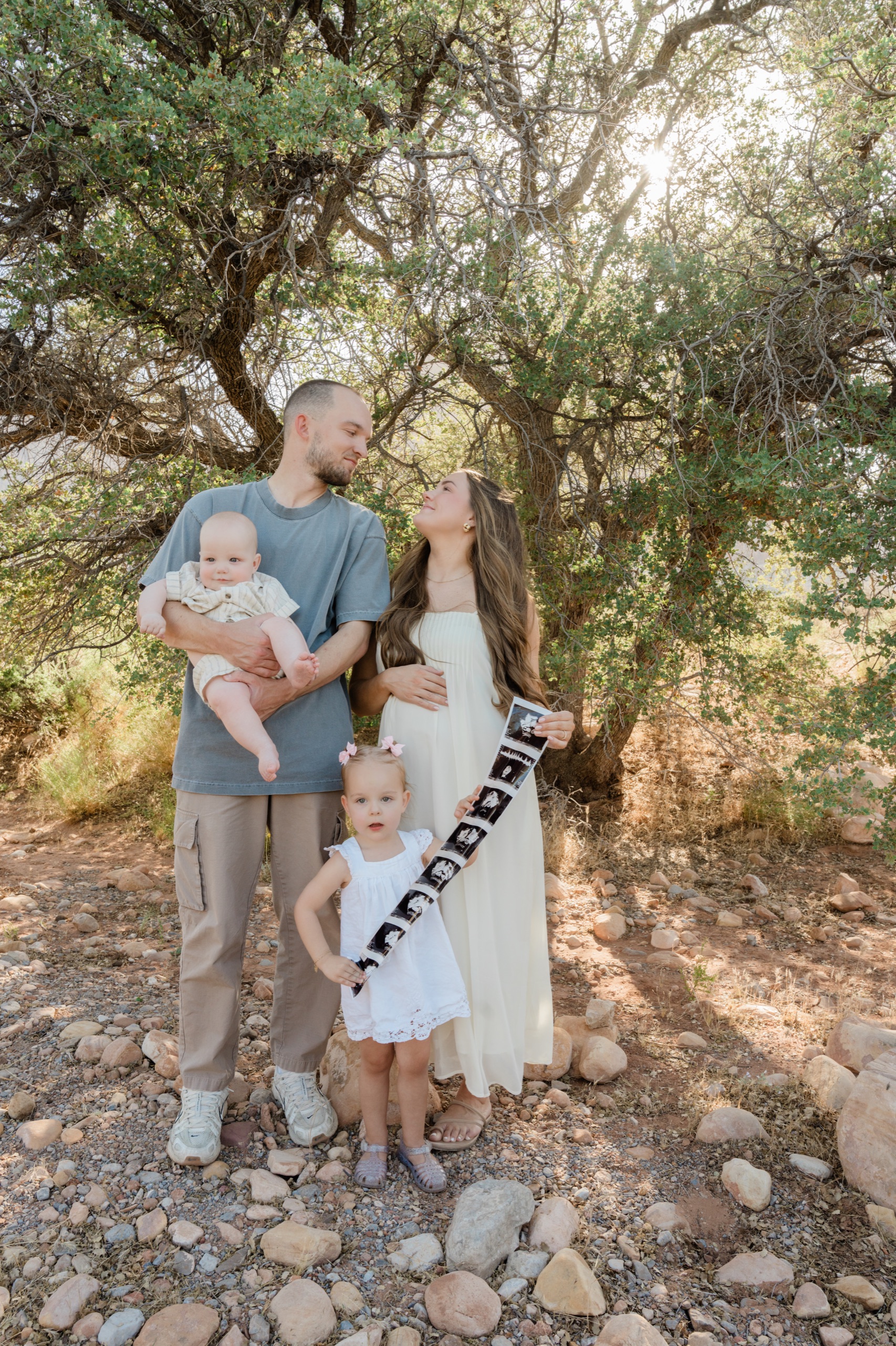 A young family sharing a pregnancy announcement