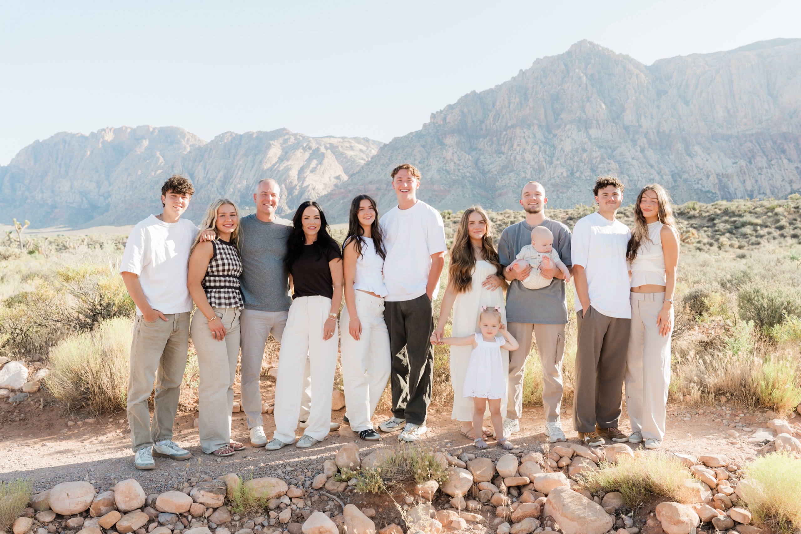The whole family with Red Rock Canyon behind them